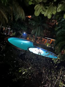 Outdoor pool illuminated at night at Villas Macondo in Tamarindo Costa Rica