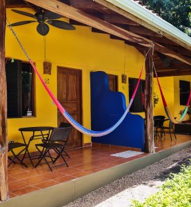Outdoor patio with hammocks and seating area at Villas Macondo in Tamarindo Costa Rica