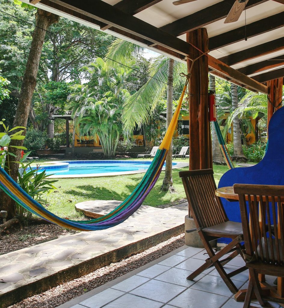 Villas Macondo Patio and Pool Hammock patio overlooking the tropical pool area at Villas Macondo in Tamarindo Costa Rica