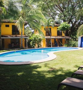 Outdoor pool surrounded by tropical gardens at Villas Macondo in Tamarindo Costa Rica