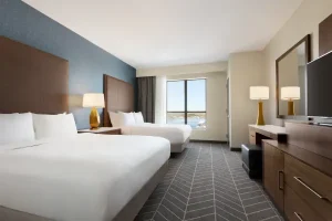 Double queen guest suite with river views at Embassy Suites by Hilton Wilmington Riverfront.