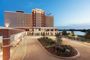Embassy Suites by Hilton Wilmington Riverfront hotel exterior overlooking the Cape Fear River in Wilmington, North Carolina.