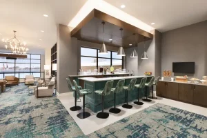 Modern lounge and bar area at Embassy Suites by Hilton Wilmington Riverfront.