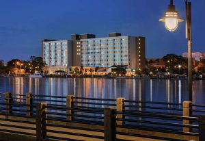 Hotel Ballast Wilmington waterfront hotel overlooking the Cape Fear River at sunset in Wilmington, North Carolina.