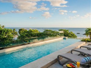 Luxury ocean view swimming pool overlooking the Pacific Ocean at a Costa Rica surf retreat accommodation.