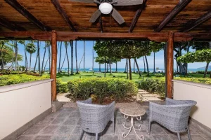 Private patio with ocean views overlooking tropical gardens at a beachfront resort in Tamarindo, Costa Rica.