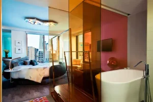 Luxury hotel suite with soaking tub and contemporary design at W New York Times Square.